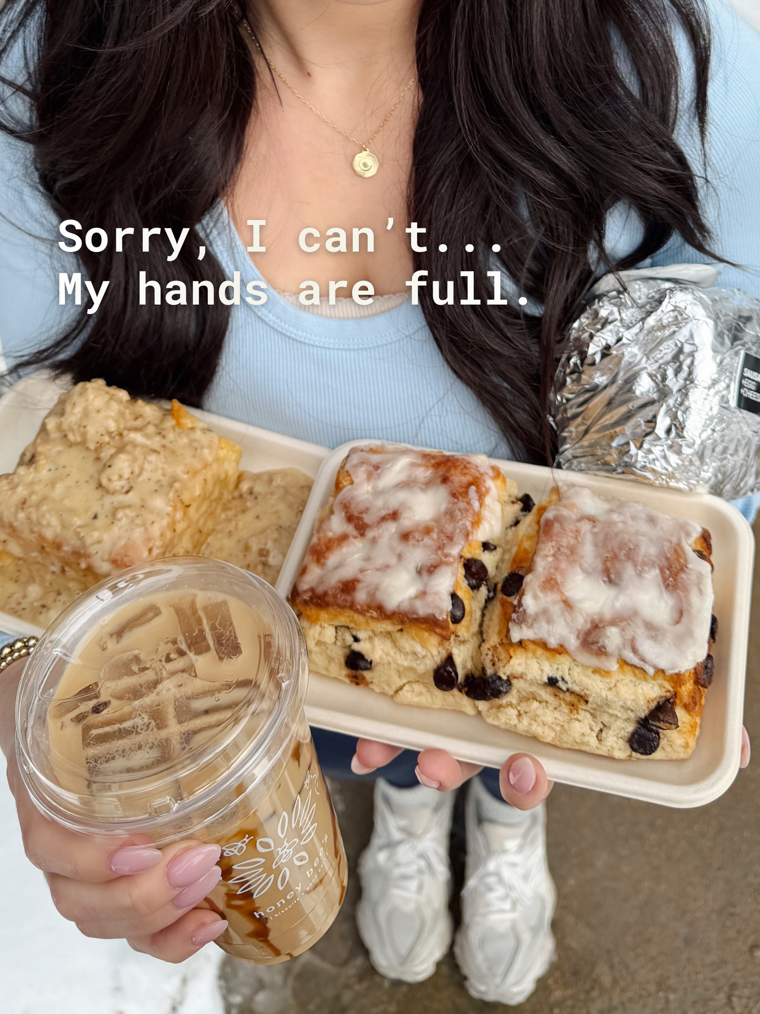 Person holding a tray of biscuits and a coffee cup with text 'Sorry, I can't... My hands are full.'