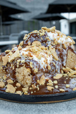 smores biscuits with chocolate and marshmallow drizzle and graham cracker crumbles